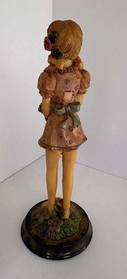Tall thin figurine vintage girl with flower   P173