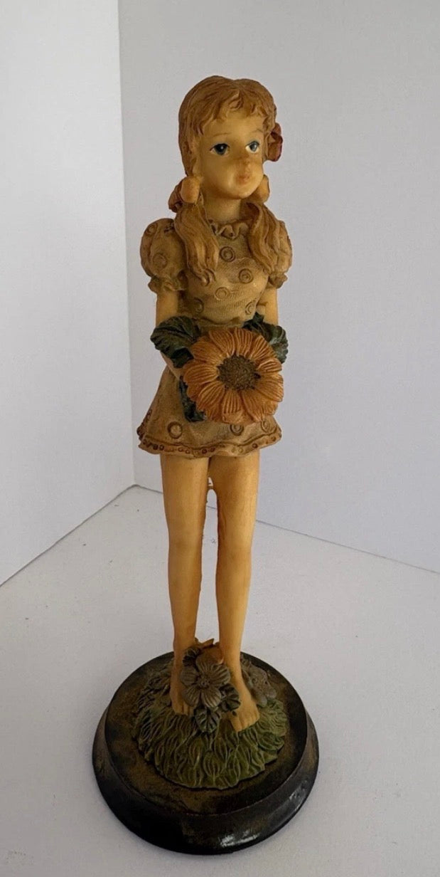 Tall thin figurine vintage girl with flower   P173